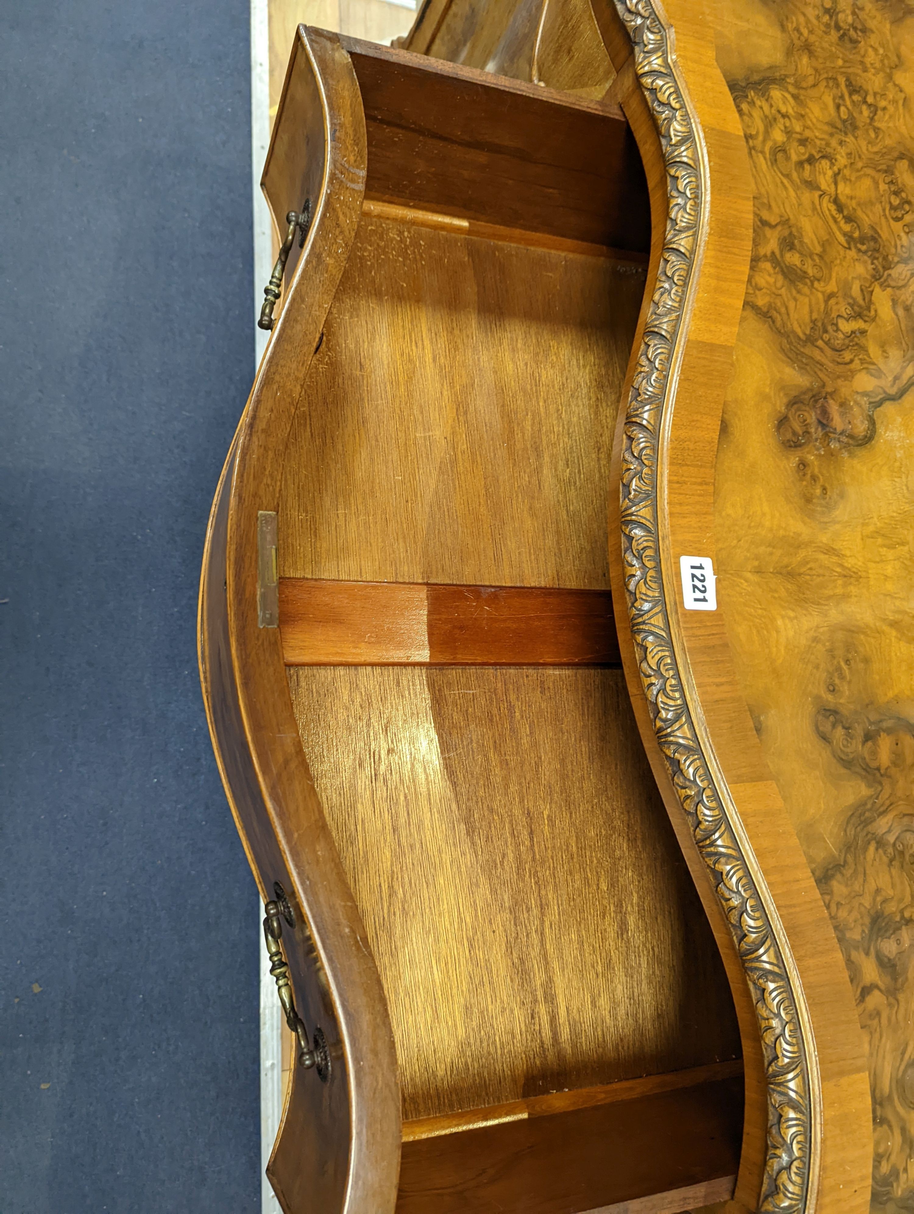 A Queen Anne revival burr walnut dining suite, comprising serpentine sideboard, length 168cm, depth 56cm, height 98cm, extending dining table, 210cm extended, one spare leaf, width 90cm, height 75cm and eight chairs, two